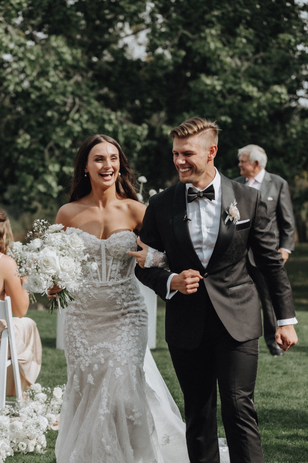 Mr + Mrs Tianna and Mitchell at the end of the ceremony, walking down the aisle, clearly elated!