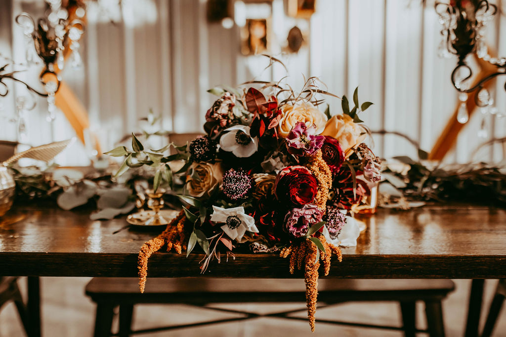 Haley's stunning bridal bouquet of dahlias, amaranthus, anemone, scabiosa, lisianthus, amaranthus, and ranunculus.