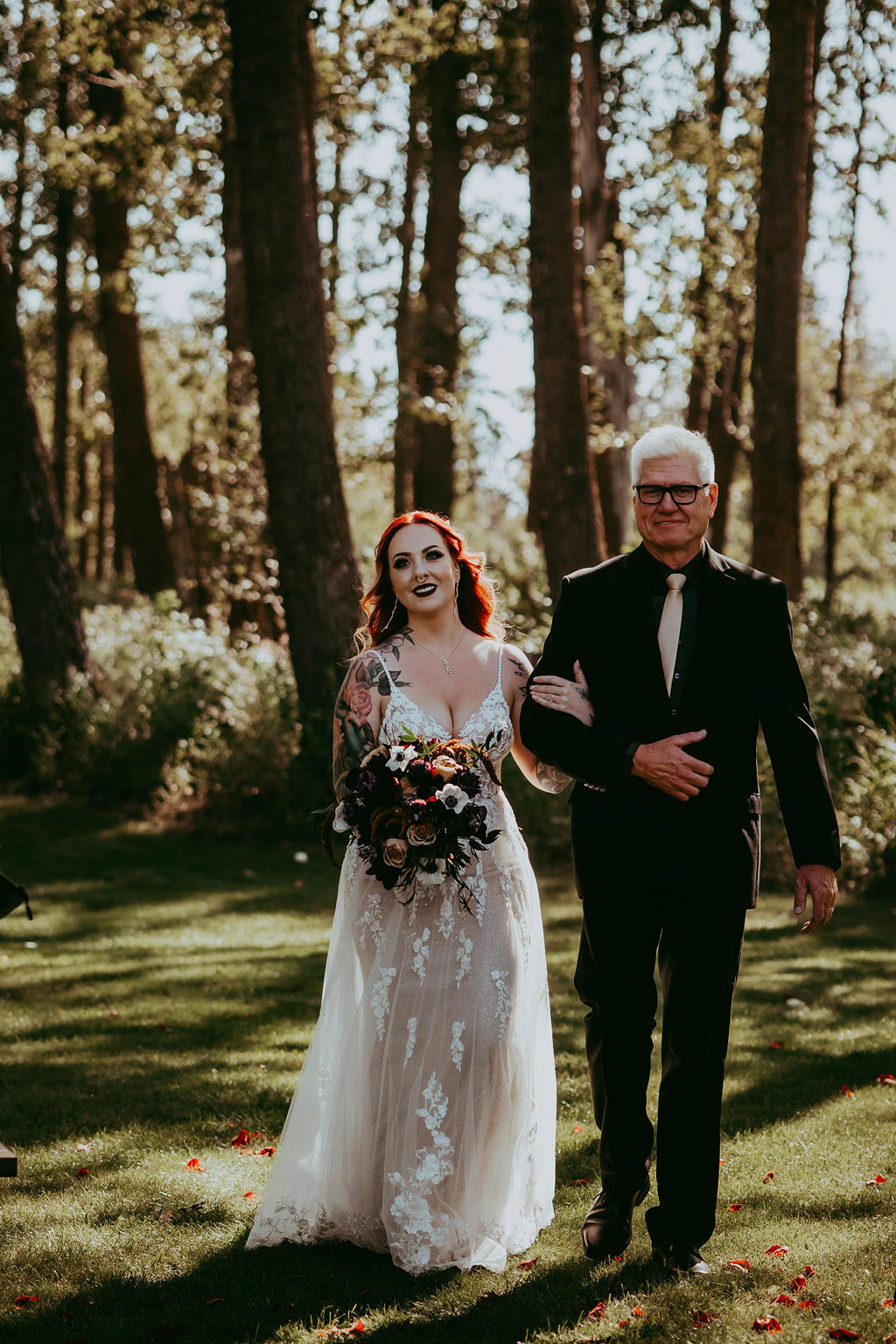 Haley's father leading her down the aisle at the ceremony.