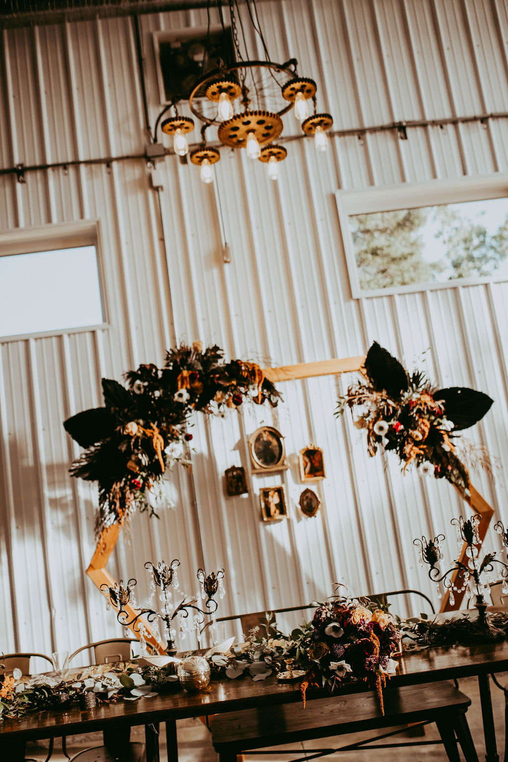 The hexagonal arch from the ceremony was reused at the reception behind the head table.