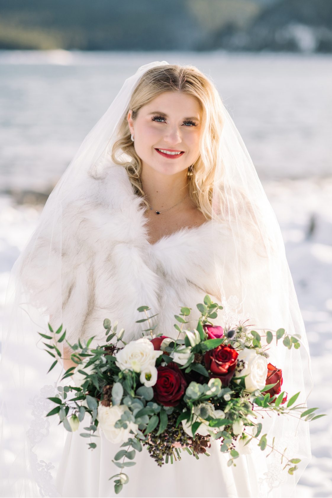 Stunning Bride Beautiful Calyx bride, Courtney in all white standing with the sunshine glowing on her, while she holds her beautiful bouquet.