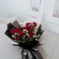 Roses Redefined from our Valentine's Day collection is a lush hand tied bouquet of roses designed with an assortment of greenery and accented with filler flower and finished with an elegant wrapping of Korean paper. Available in three colours and three sizes.