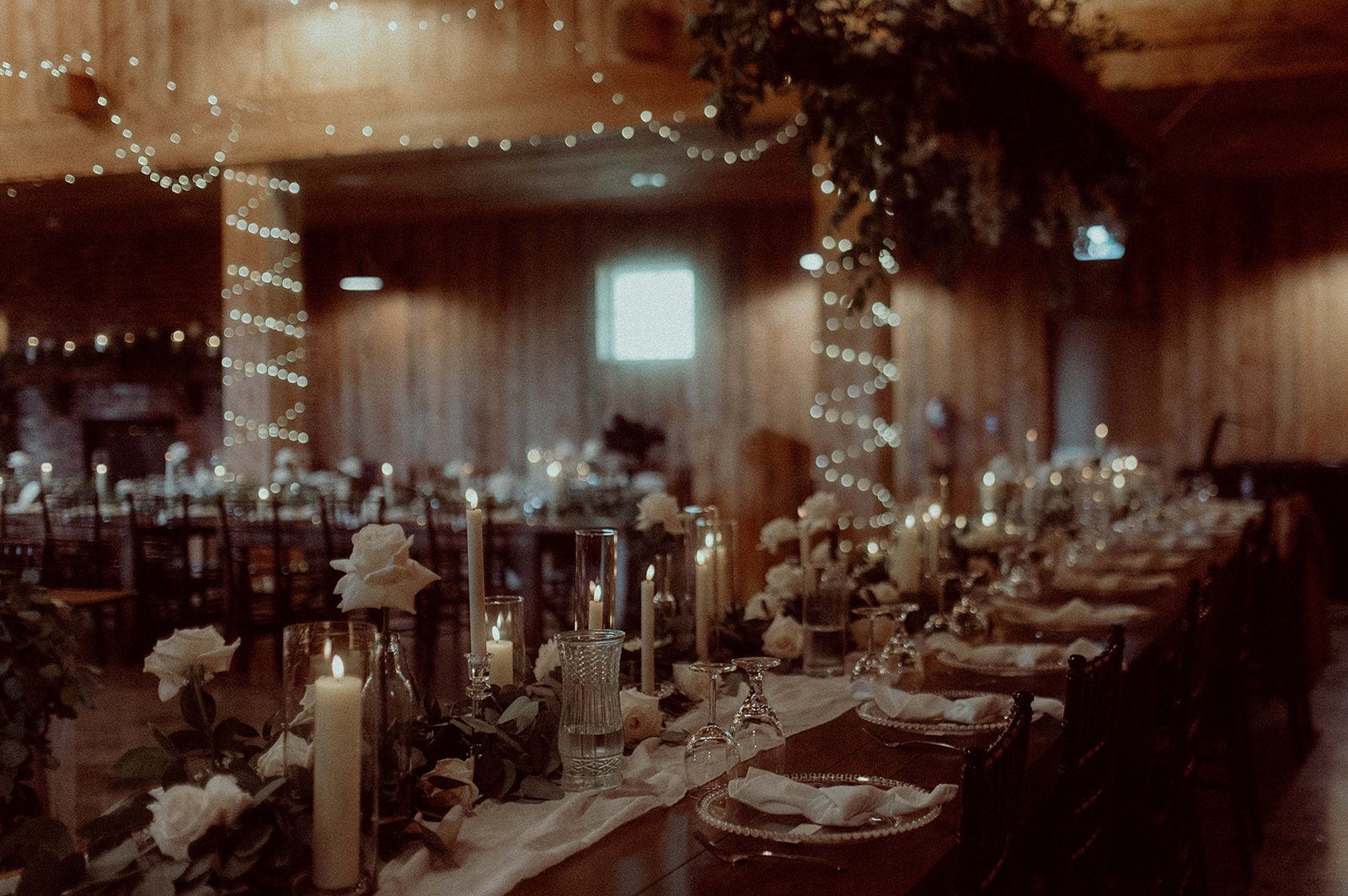 The reception space looking fabulous glowing with candles and twinkle lights.