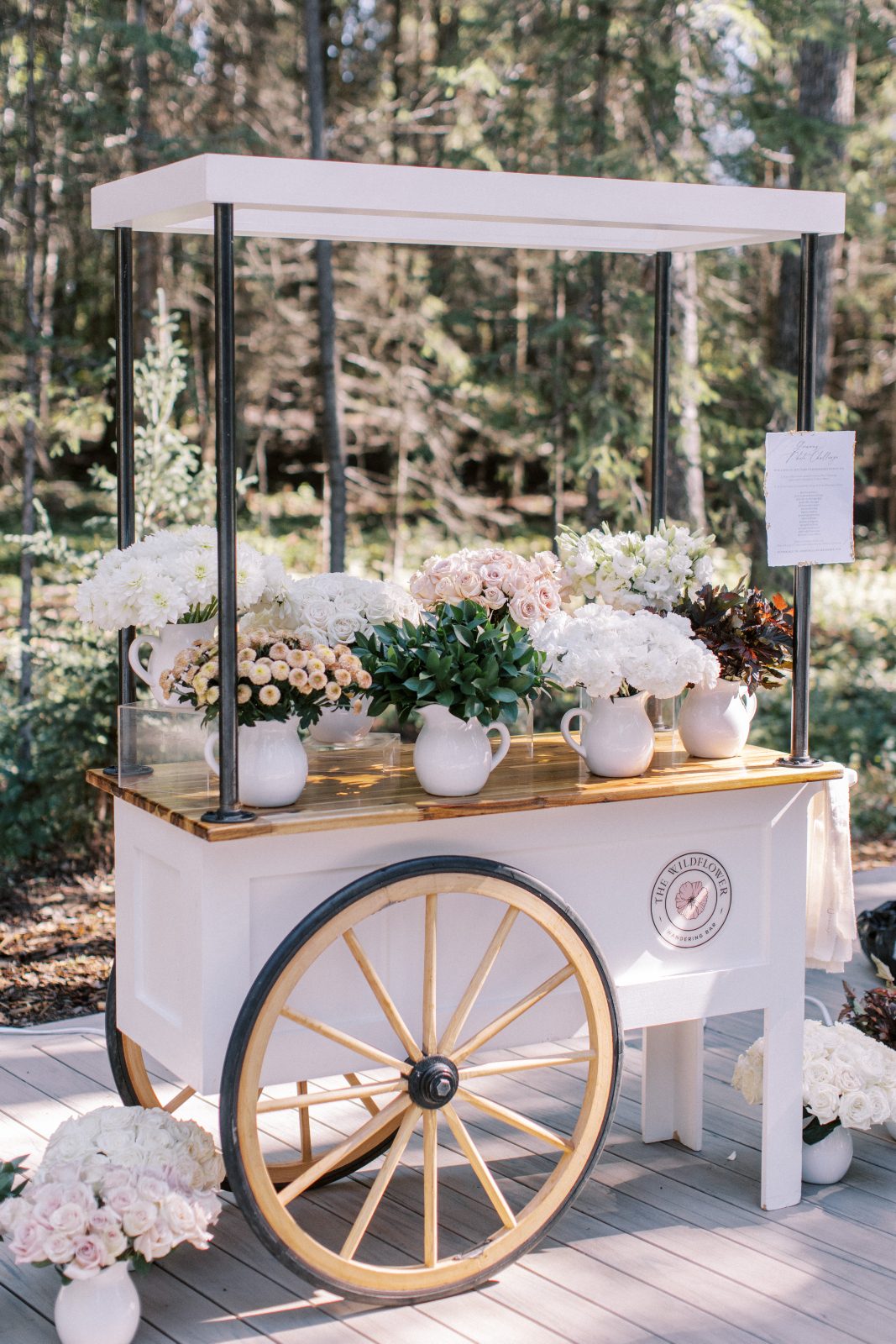 Adorable floral cart for a flower bar to make up miniature bouquets for all the guests who attended the event.
