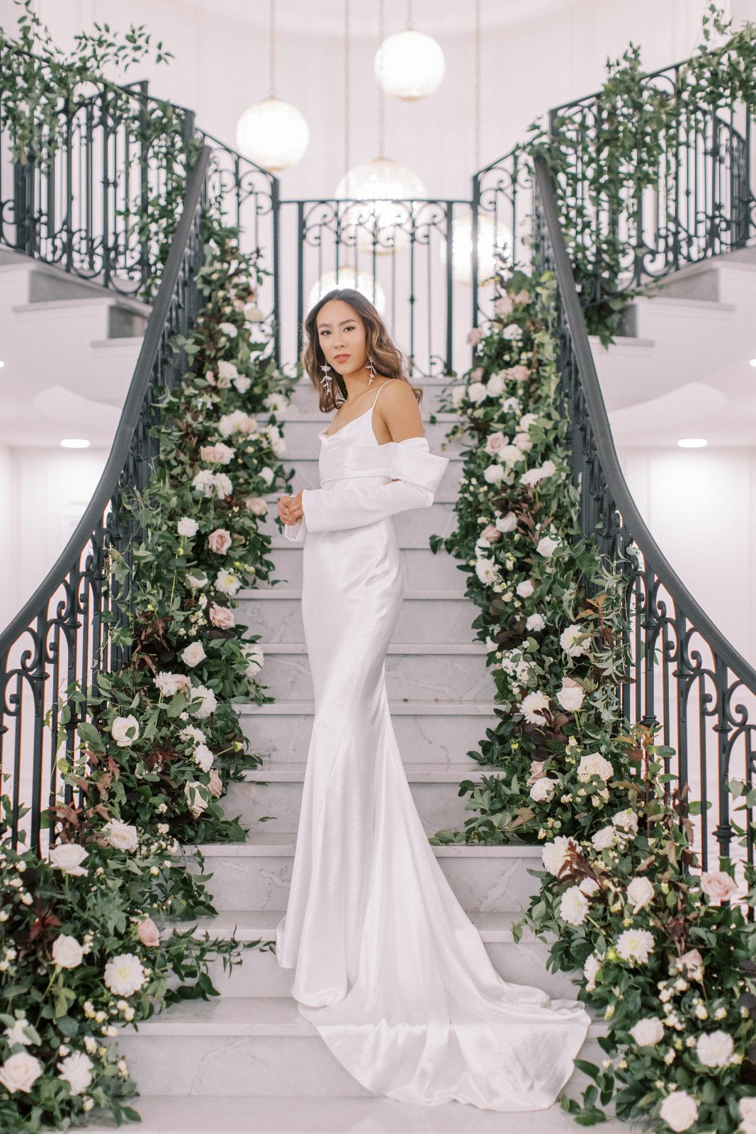 A sleek satiny gown, simple and elegant with beautiful detached sleeves for a little flair.