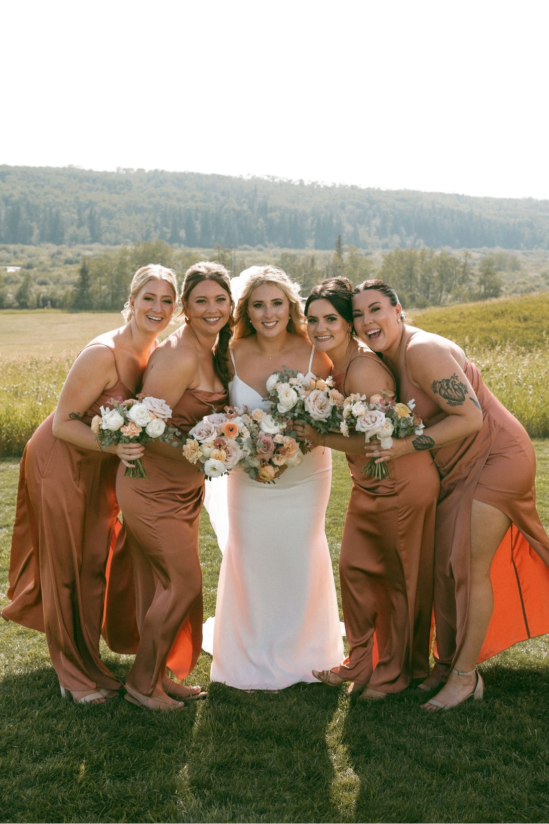 Katrina and her bridesmaids cozy up for a sweet photo of them all beaming.