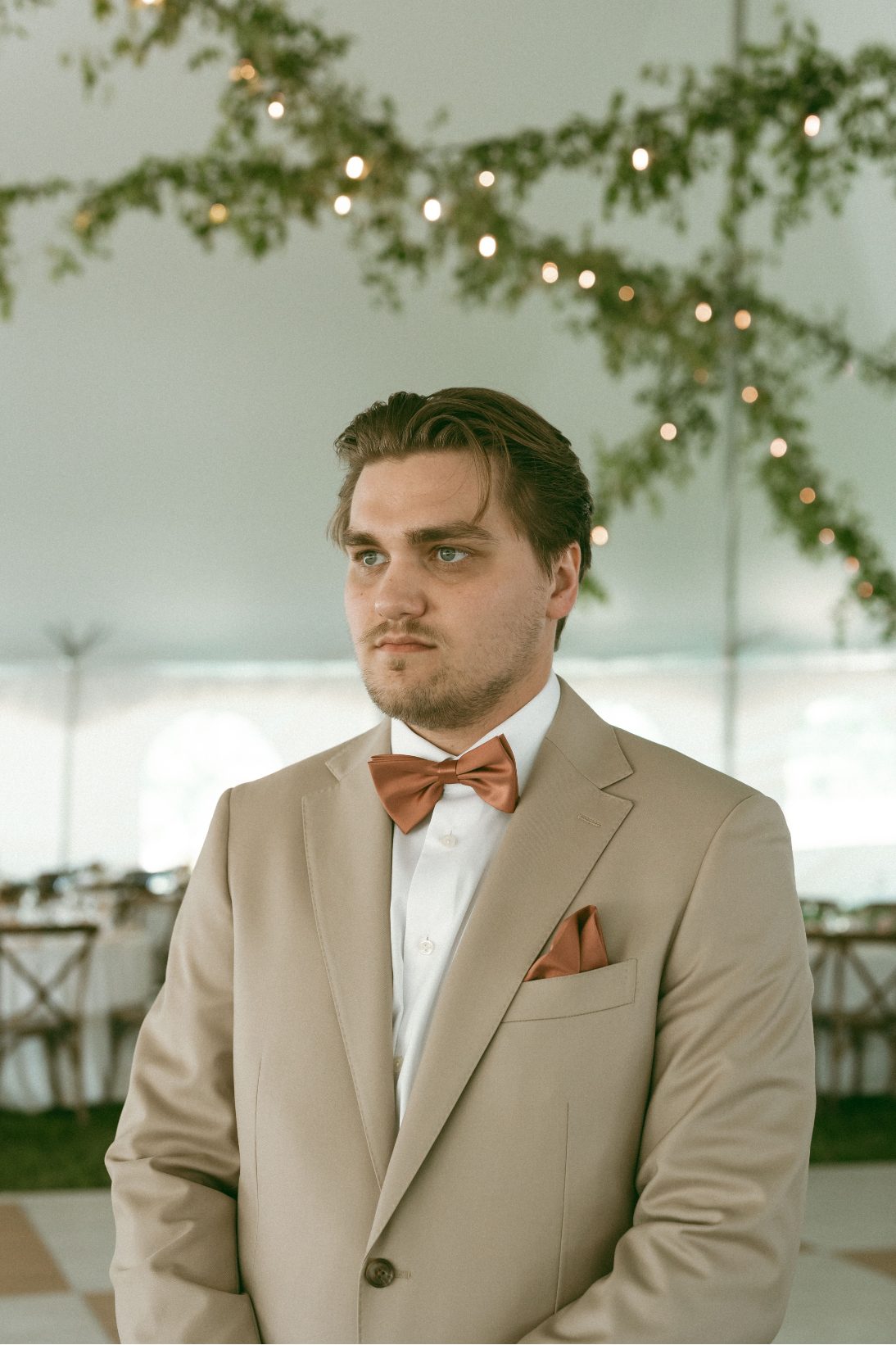Ruggedly handsome groom, Connor, waiting for his bride.