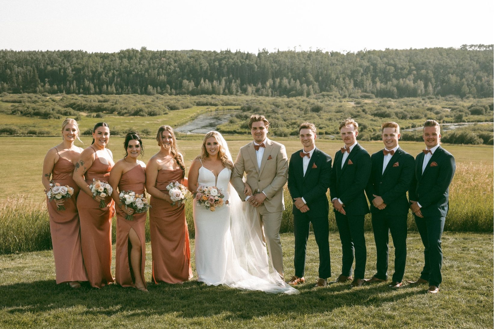 A formal picture of Katrina and Conner with their wedding party lined up besides them.