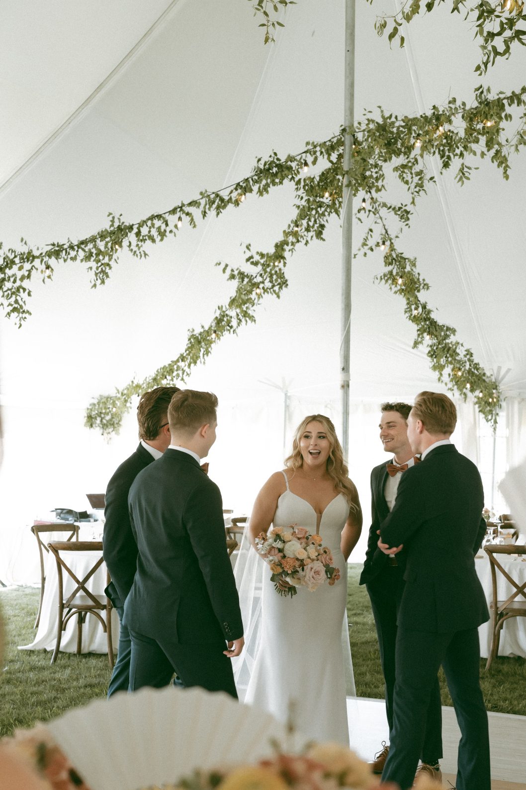Katrina hanging out with the groomsmen sharing a few laughs before the ceremony.