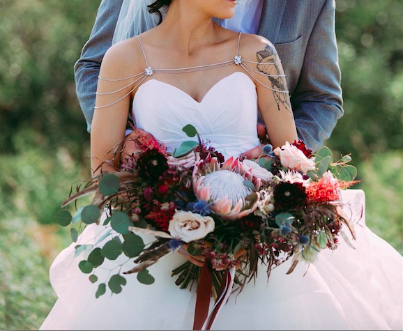 Bella Sprout Modern Elegance Bride A "Modern Elegance" bouquet in pinks, reds and burgundy featuring a huge King Protea.