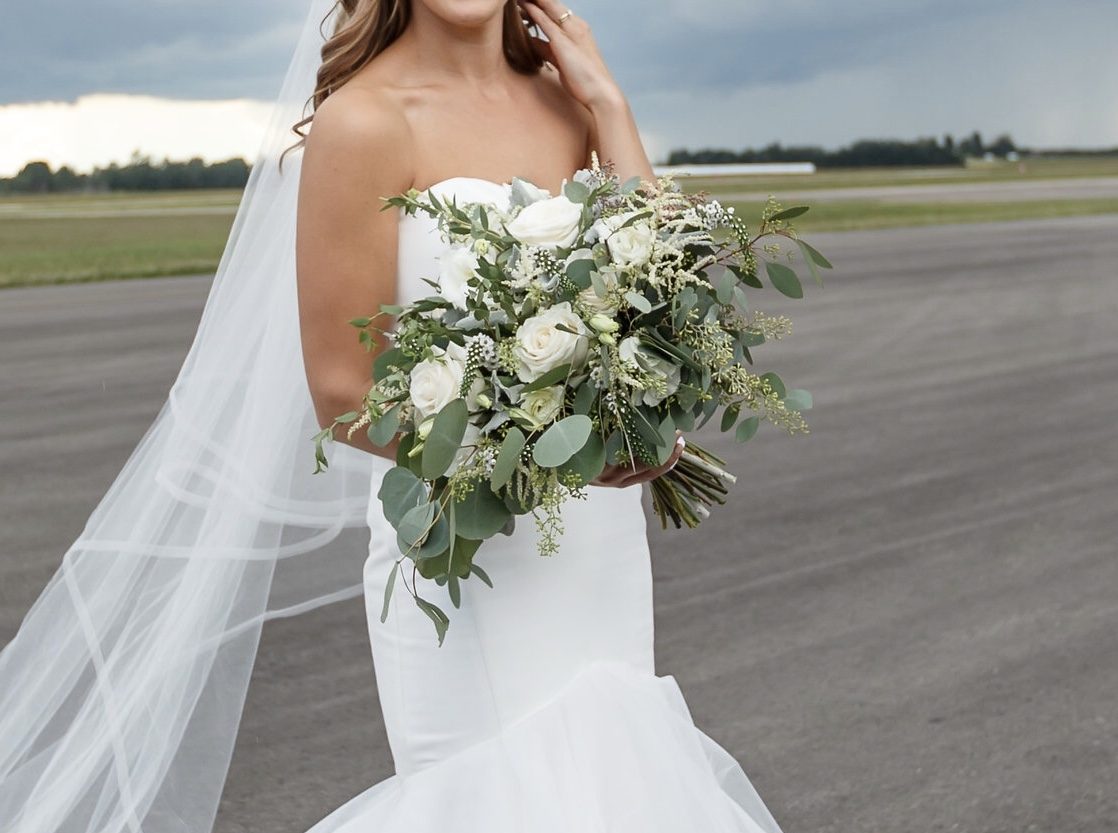 Bella Sprout Woodland Greens Bouquet "Woodland Greens" Bouquet in a mixture of white, ivory and green with a very organic natural style using roses, ranunculus, lisianthus and astilbe with an assortment of eucalyptus.