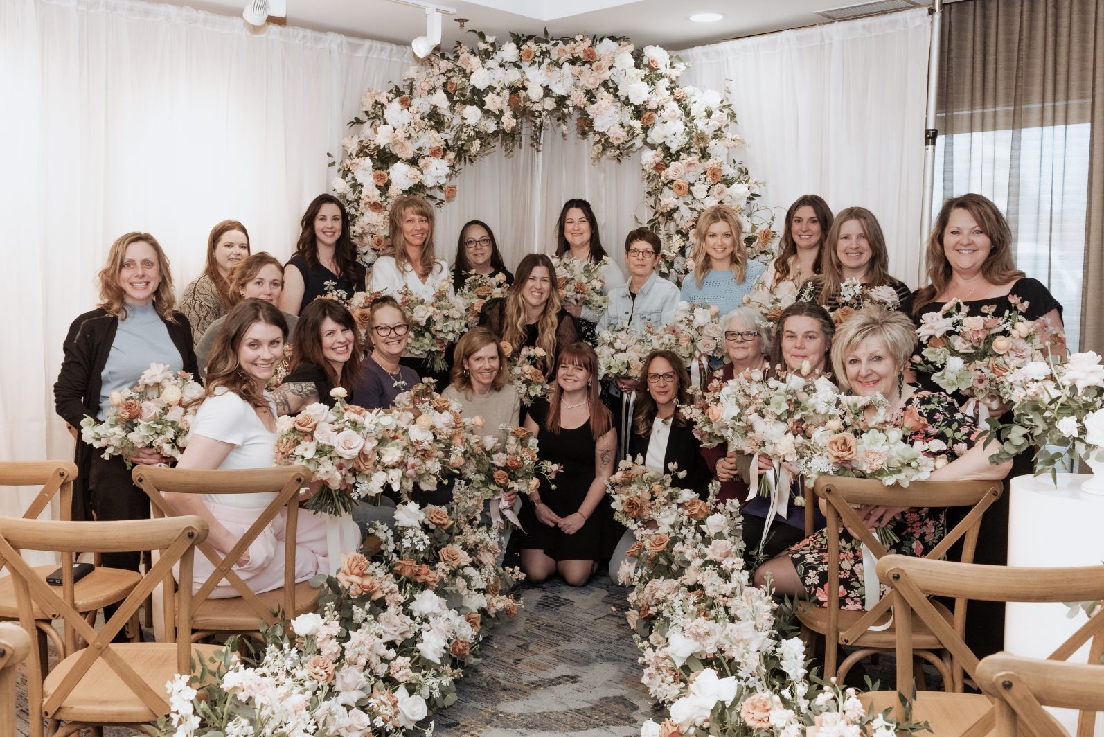 The whole class of people who participated in one of the Floral classes on wedding work.