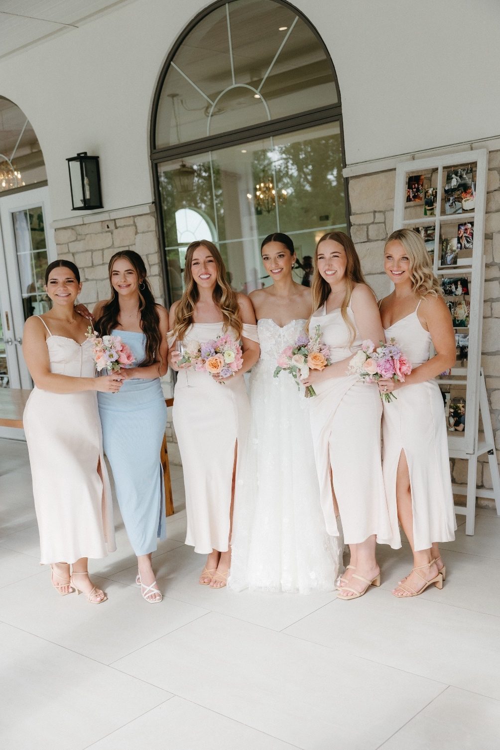 Bridal Party at Reception Alyssa and her bridesmaids holding their bouquets outside Sparrow Lane before the reception starts.