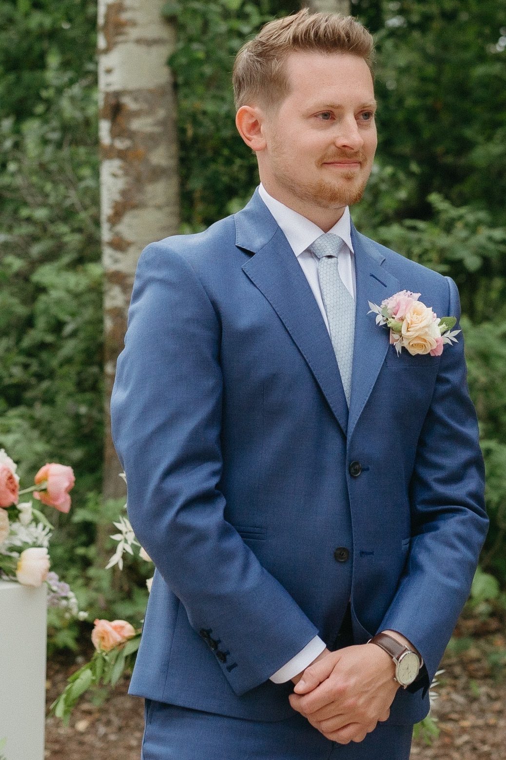 Groom Topher awaiting his bride at the ceremony.