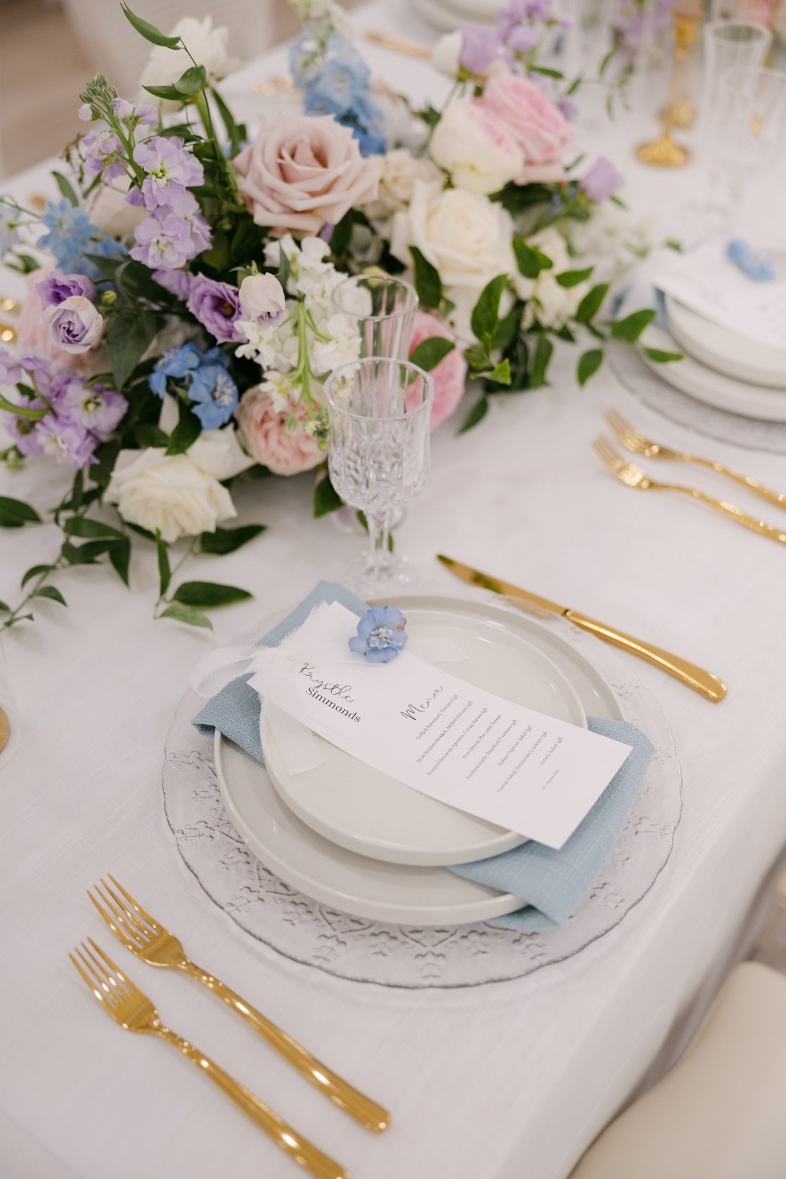 Very chic looking place setting with the polished gold accents, and customized menu cards.