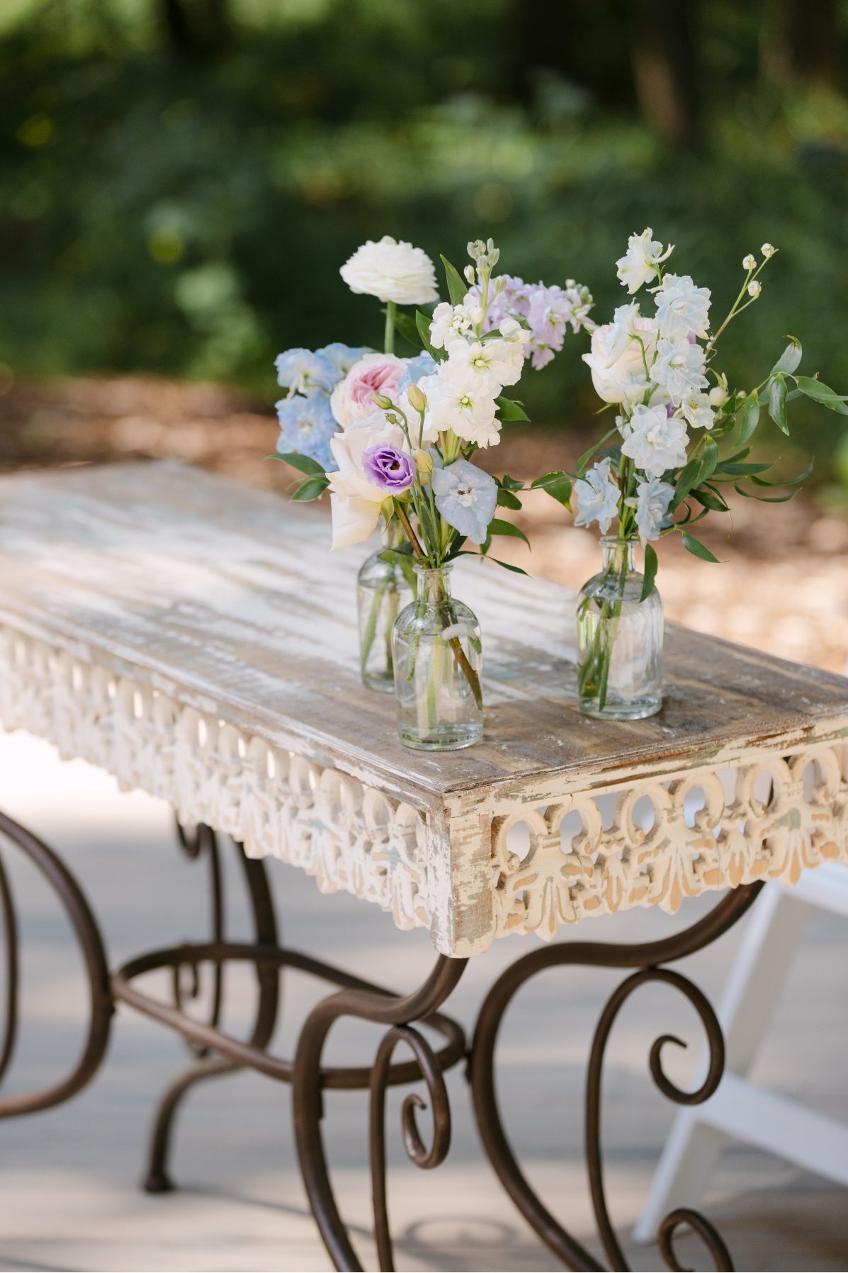 The signing table at the ceremony accented with a few bud vases with clusters of pastel blooms.