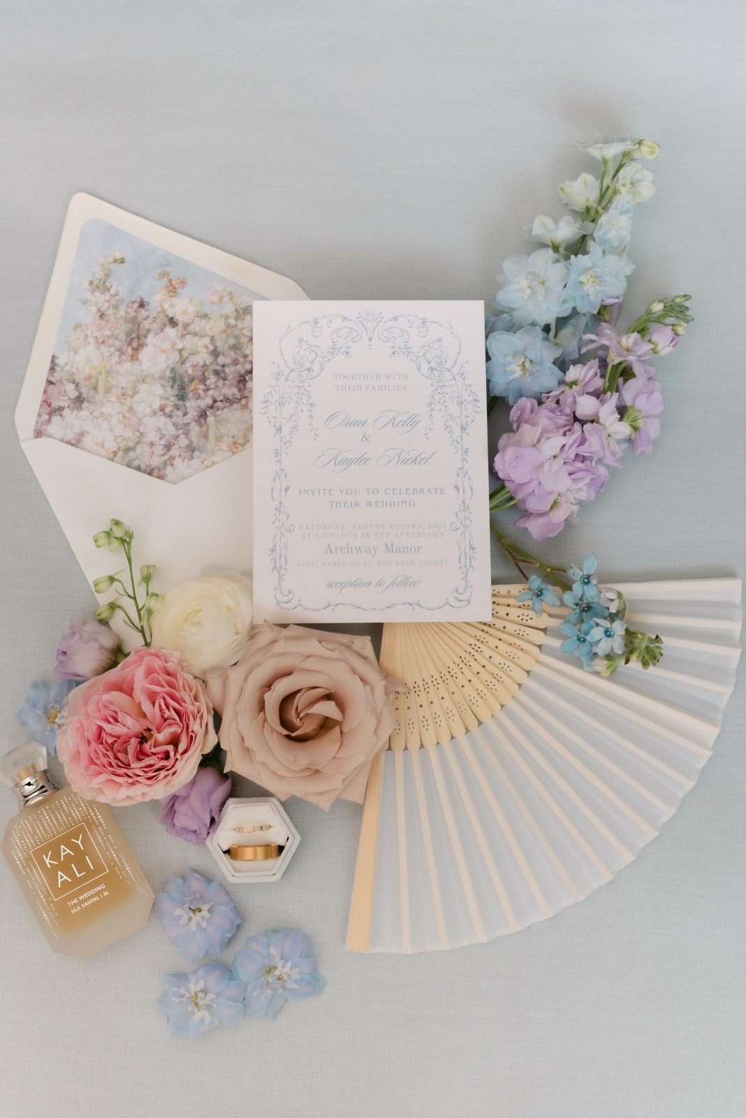 Grand luxury wedding flat lay florals with garden roses in pastel tones of white, blush, pink, pale blue and lavender, light purple at Archway Manor