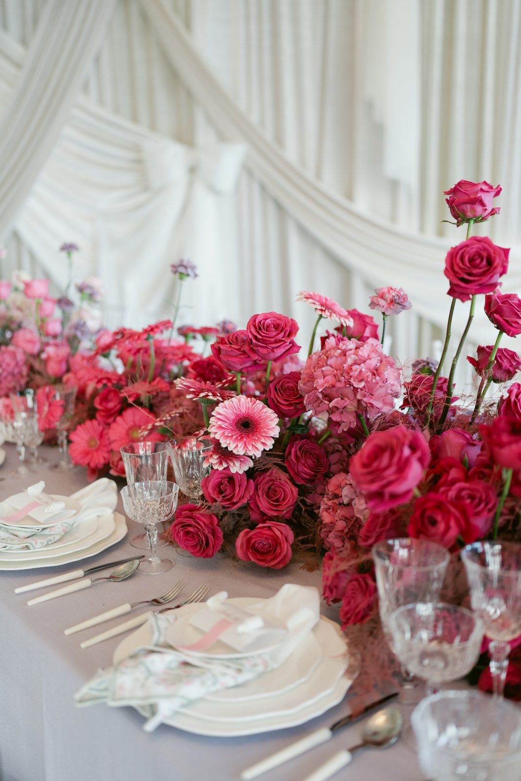Pink ombre luxury long table centerpiece with modern white draping