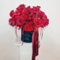 A beautiful black velvet hat box designed with reflexed red roses