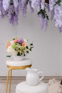 Brooke's Garden is a beautiful white pitcher filled with pastel spring blooms