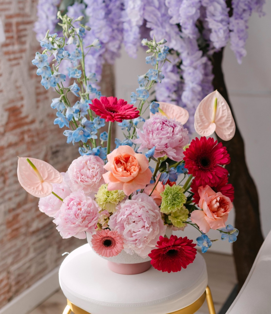 Calyx | Mothers Day 2026 The Daymaker is a Mother's Day arrangement full of colour and texture featuring delphinium, peonies, gerbera daisies and roses.