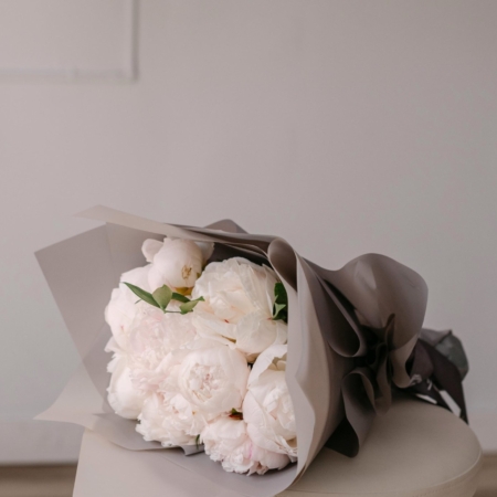From our Mother's Day collection, a hand tied bouquet of big, fluffy peony blooms accented with greenery.