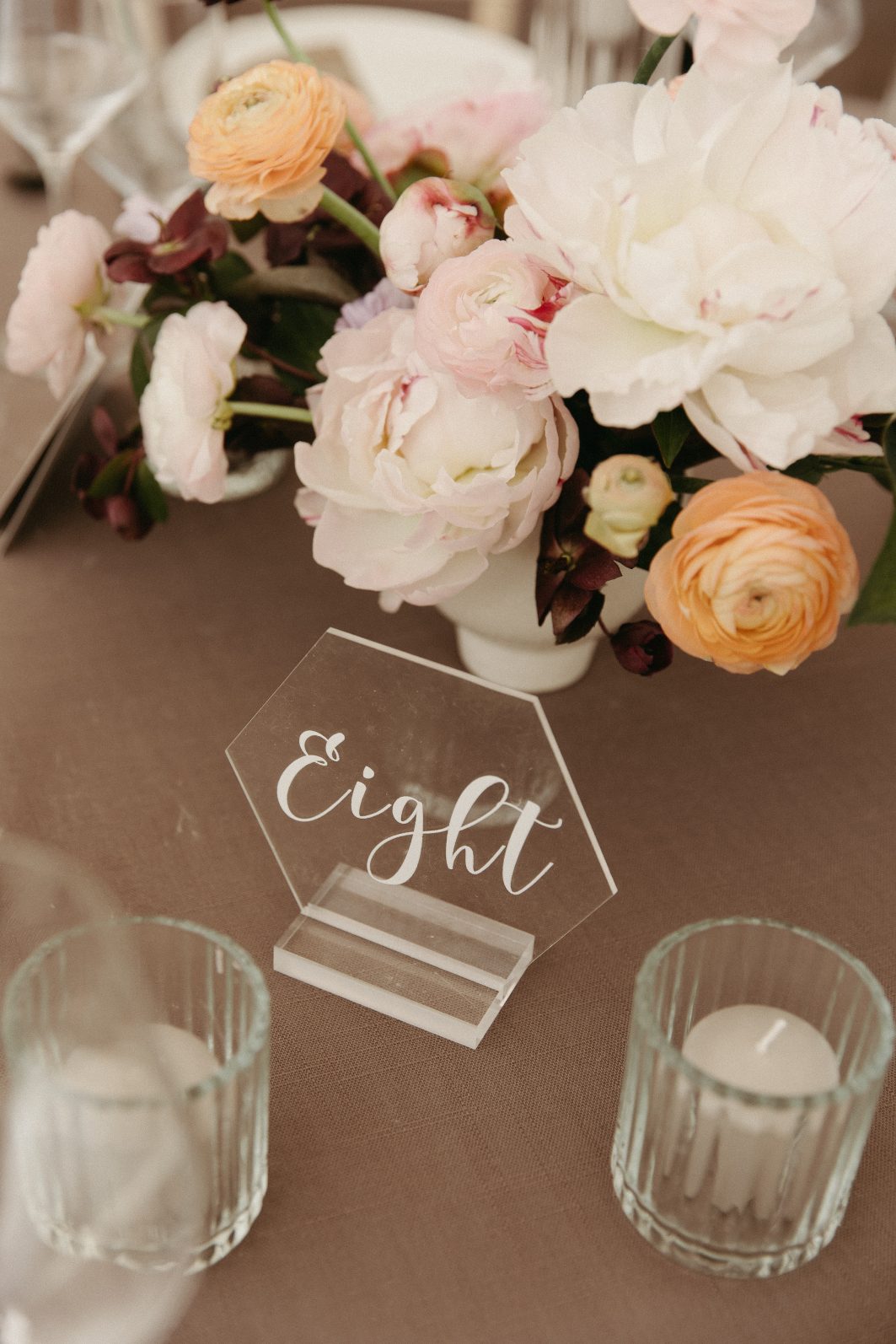 Pretty white peonies in a compote centrepiece at Hilltop Wedding Center.