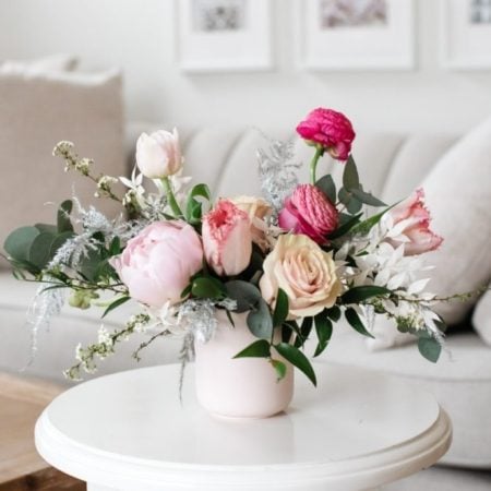 Spring floral arrangement featuring peonies, tulips and roses in varying pink shades