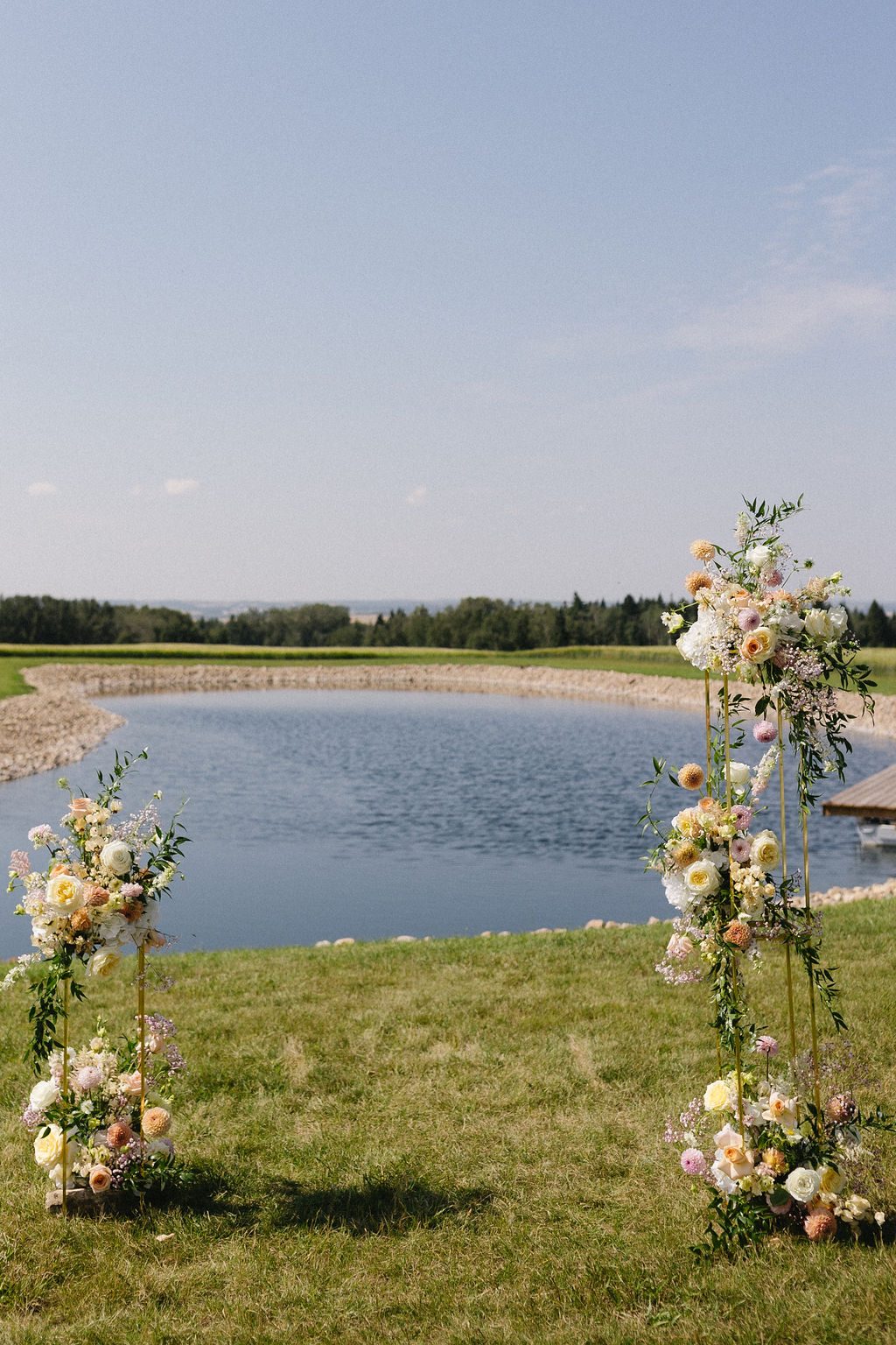 Pastel Ceremony Arrangements on Gold Stands