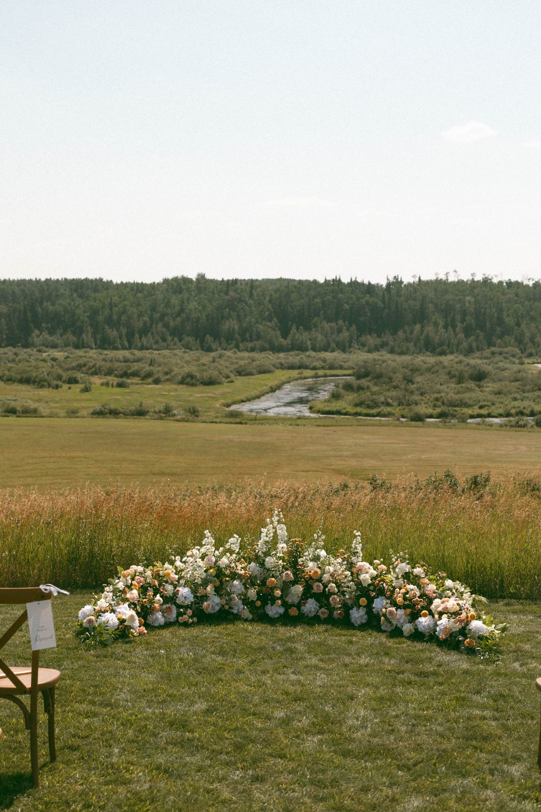 Rural Alberta Wedding Peach and White Ground Arch