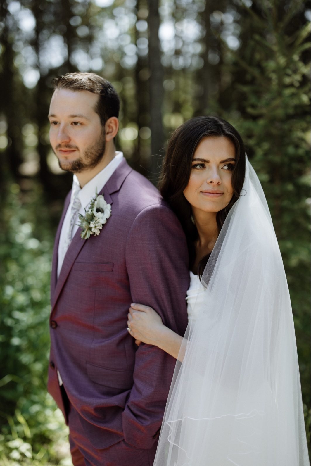 White + Green Wedding Bride and Groom Bride and Groom stand together in the forest at Archway Manor for their white and green wedding.