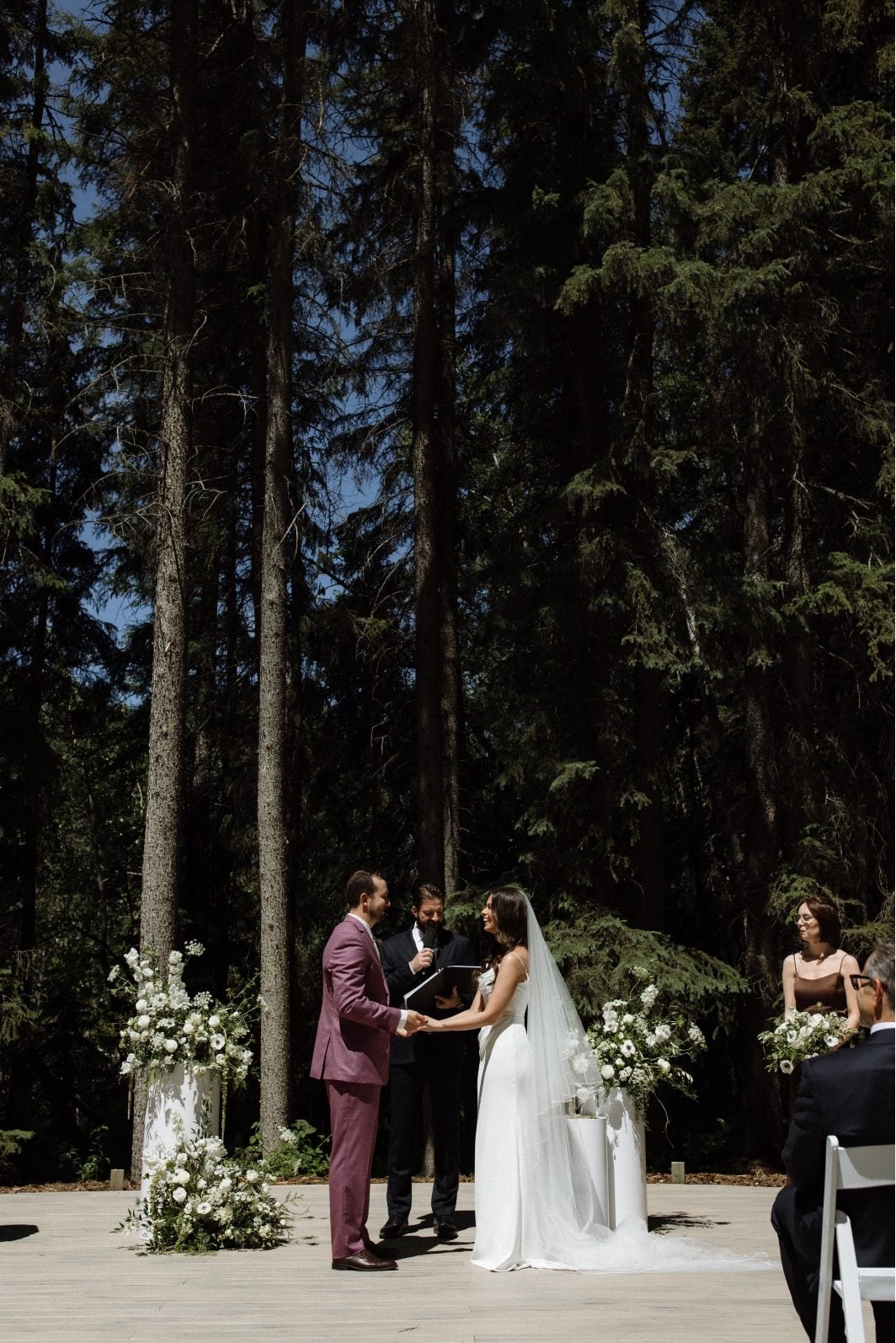 White and Green Wedding Ceremony at Archway Manor Bride and Groom stand together at the alter of their white and green wedding ceremony at Archway Manor.