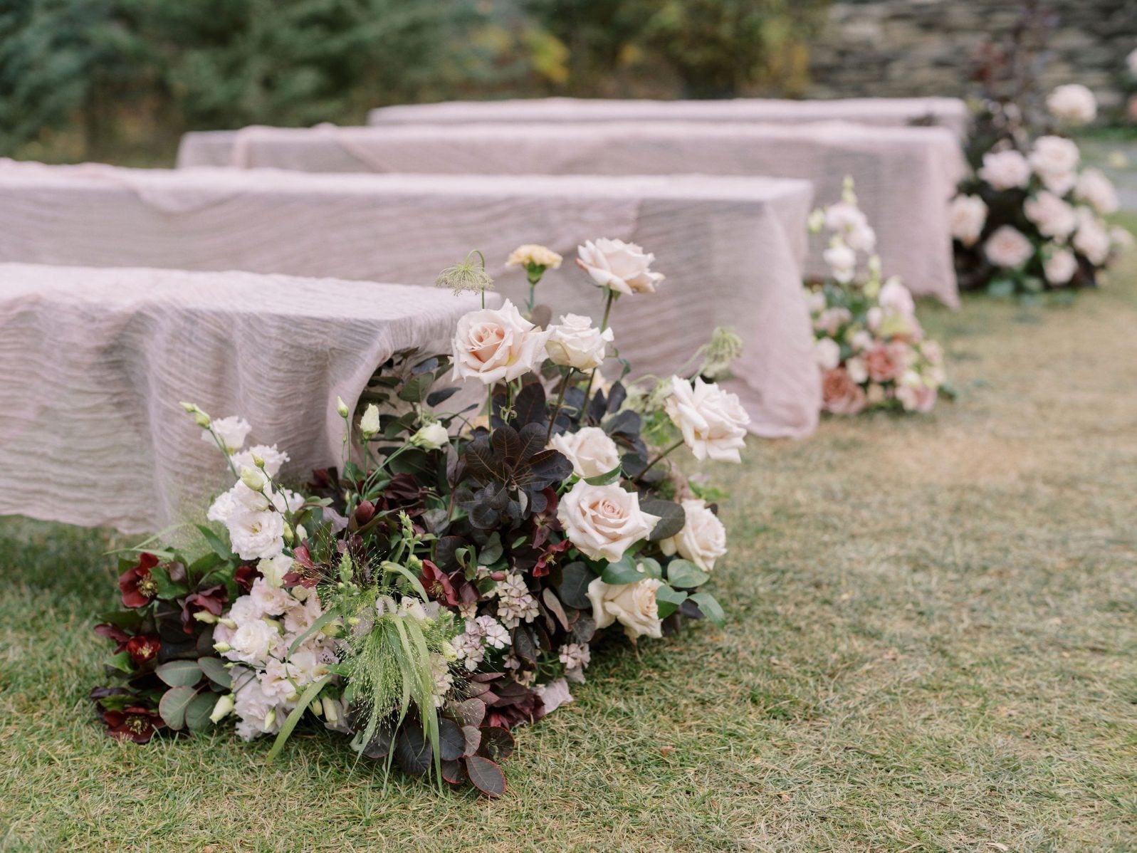 Justine Milton Marsala True to Hue Aisle Arrangements A large aisle arrangement from blush to deep burgundy for this marsala True to Hue photoshoot at The Valley.