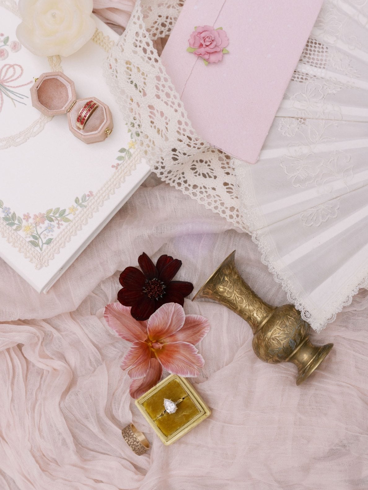Justine Milton True to Hue Marsala Flatlay True to Hue Marsala flatly including rings, stationery, burgundy blooms and boho accents.