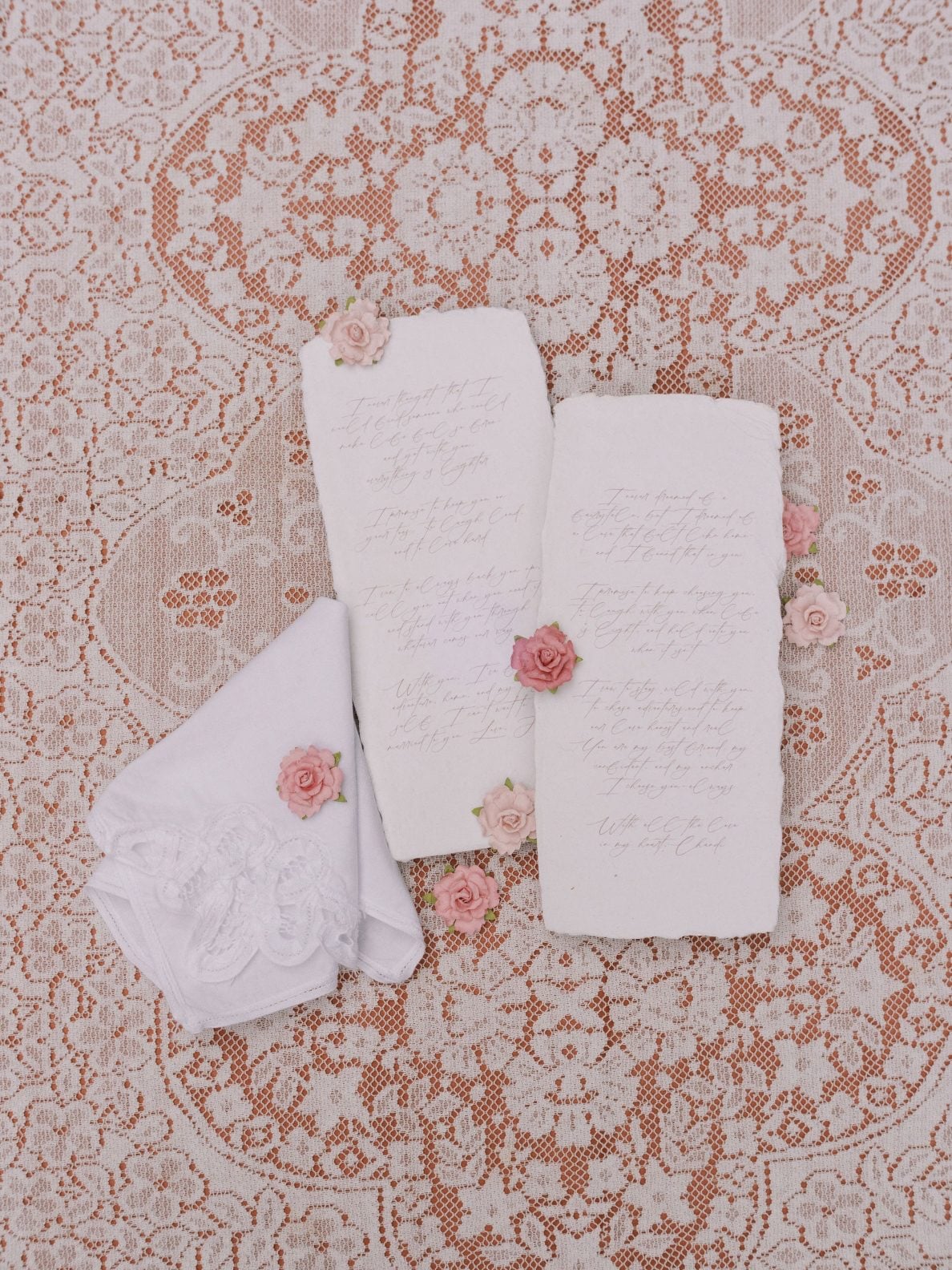 Justine Milton True to Huge Marsala Stationery Elegant stationery with rose accents displayed on lace fabric for this marsala True to Hue Shoot by Bronte Bride.