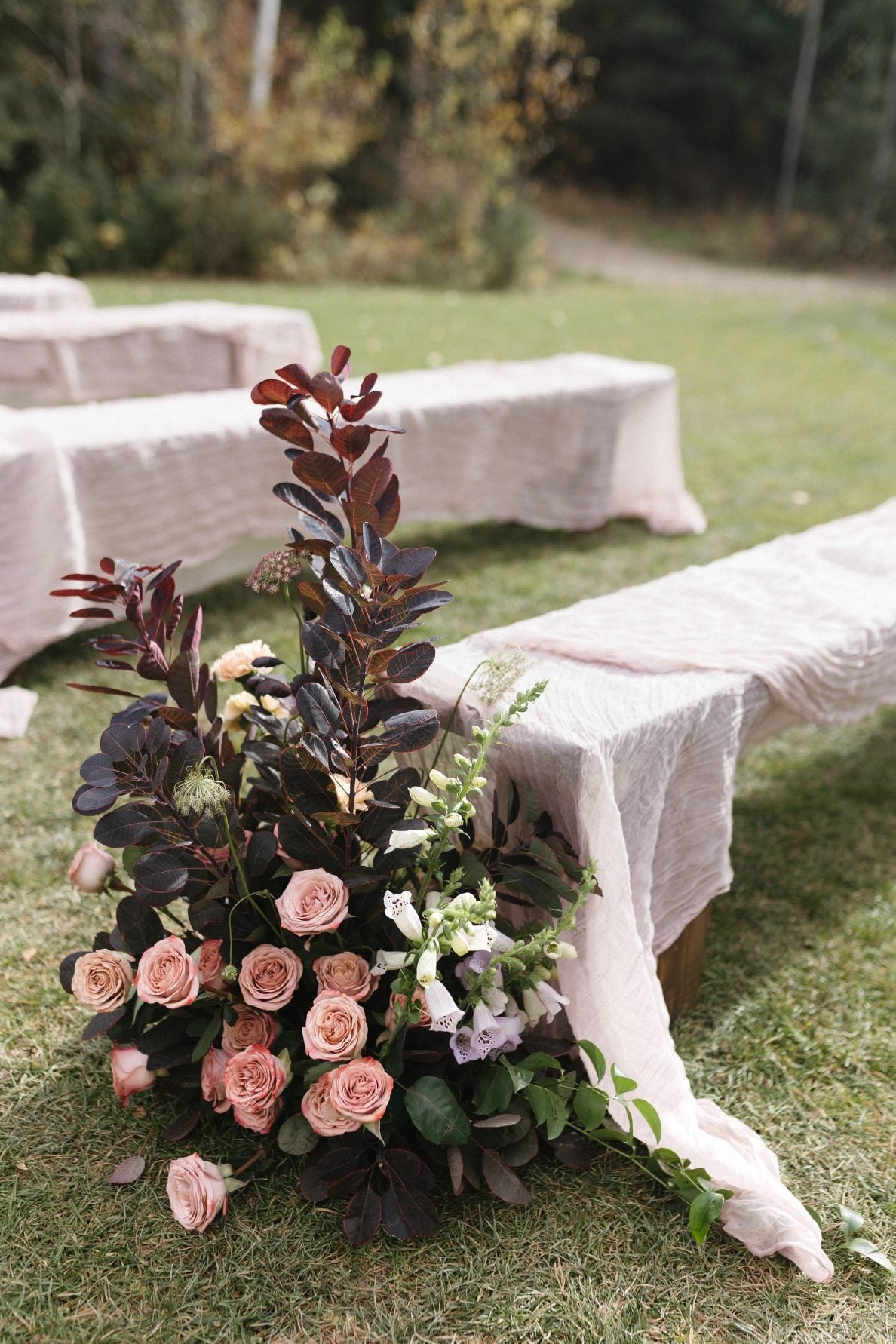 Nikki Collette Marsala True to Hue Aisle Arrangement A stunning aisle arrangement for the marsala True to Hue photoshoot featuring foxglove, smokebush, chocolate lace and cappuccino roses.