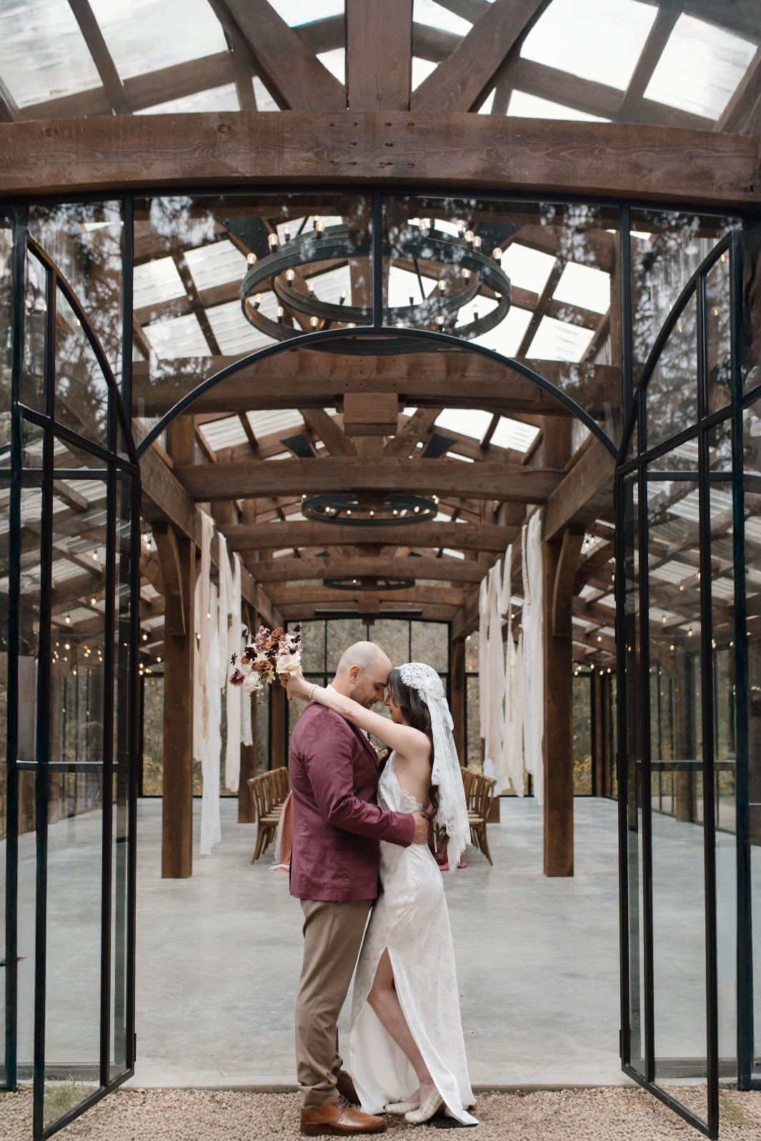 Nikki Collette True to Hue The Valley Reception Space Couple embrace infant of the reception space at The Valley sharing an intimate moment.