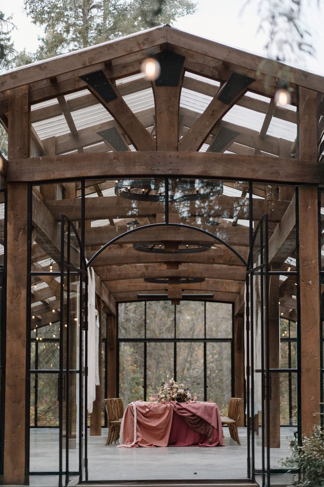 Nikki Collette True to Hue at The Valley The view looking into the reception space at The Valley through its many windows and open front doors, looking down the length of the magnificent marsala inspired table scape.