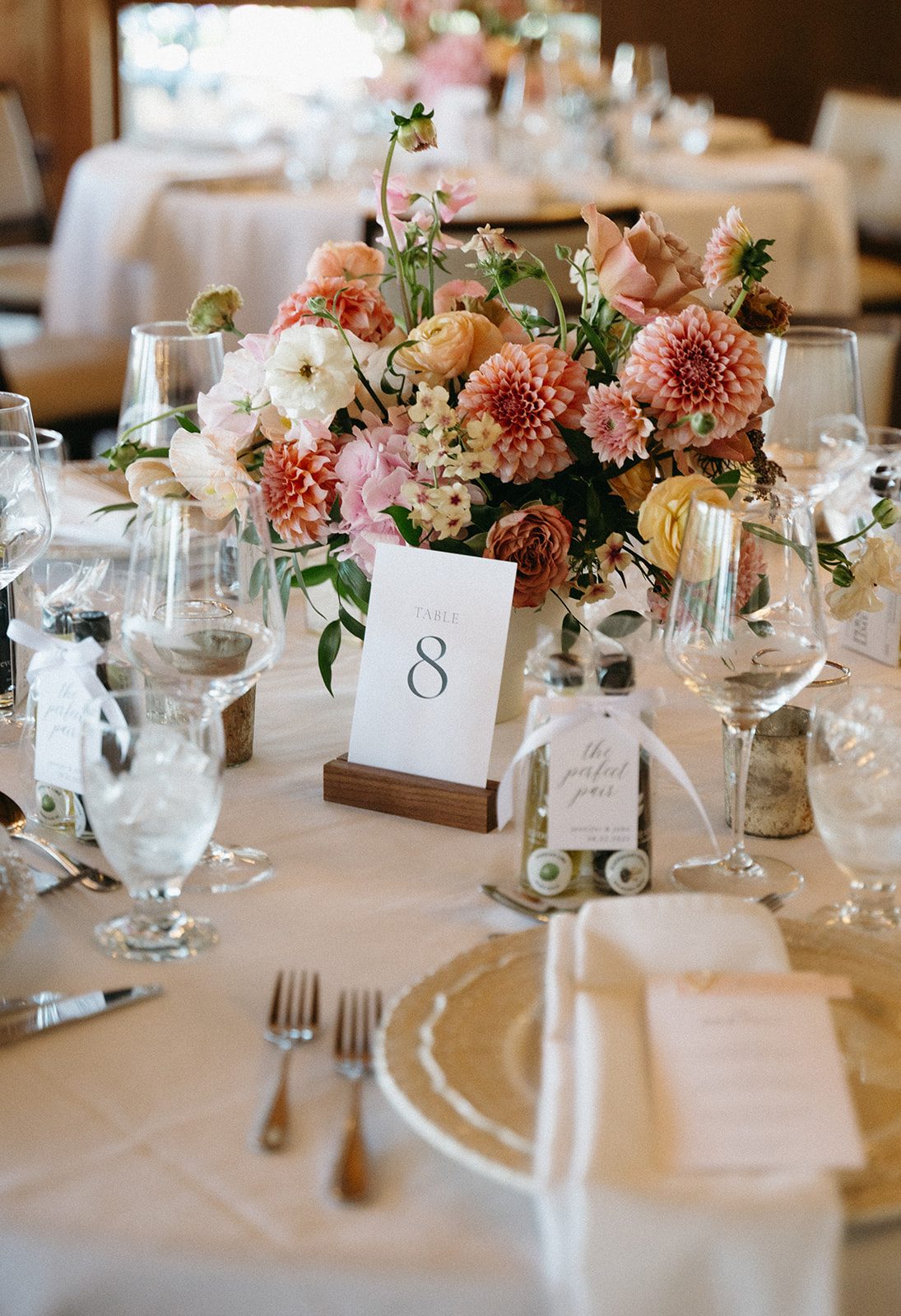 Stunning garden inspired centrepiece featuring dahlias, hydrangea, roses, ranunculus, lisianthus, and phlox in pinks and peaches.