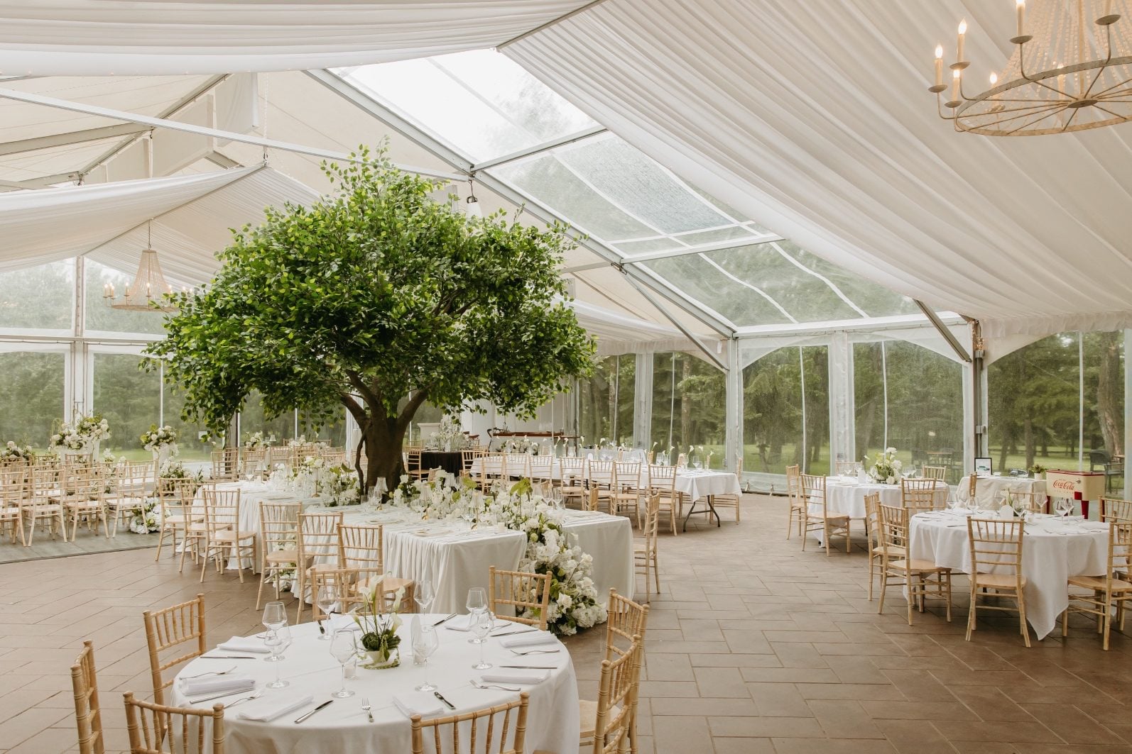 White + Green Wedding Flowers Reception White and green wedding flowers filling the gorgeous set up in Hilltop's tent, including 3 different styles of centrepieces, a large feature table, a miniature ceremony set up, sweetheart table, seating area and bar.