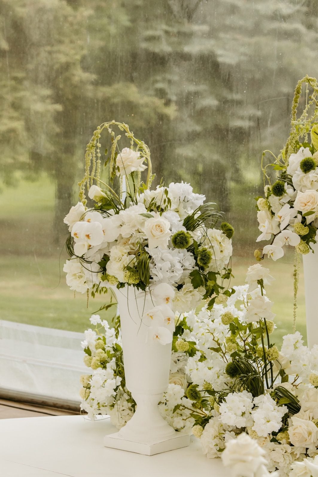 White and Green Wedding Flowers Ceremony Arrangements Stunning green and white wedding flower ceremony arrangement accenting the circular altar.