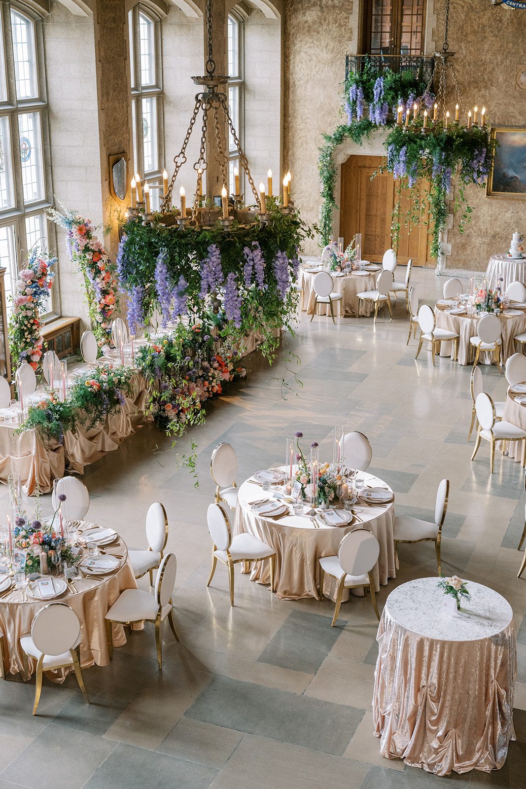 Lottie Elegant Fairmont Banff Springs wedding reception filled with colourful flowers, lush greenery and candlelight.